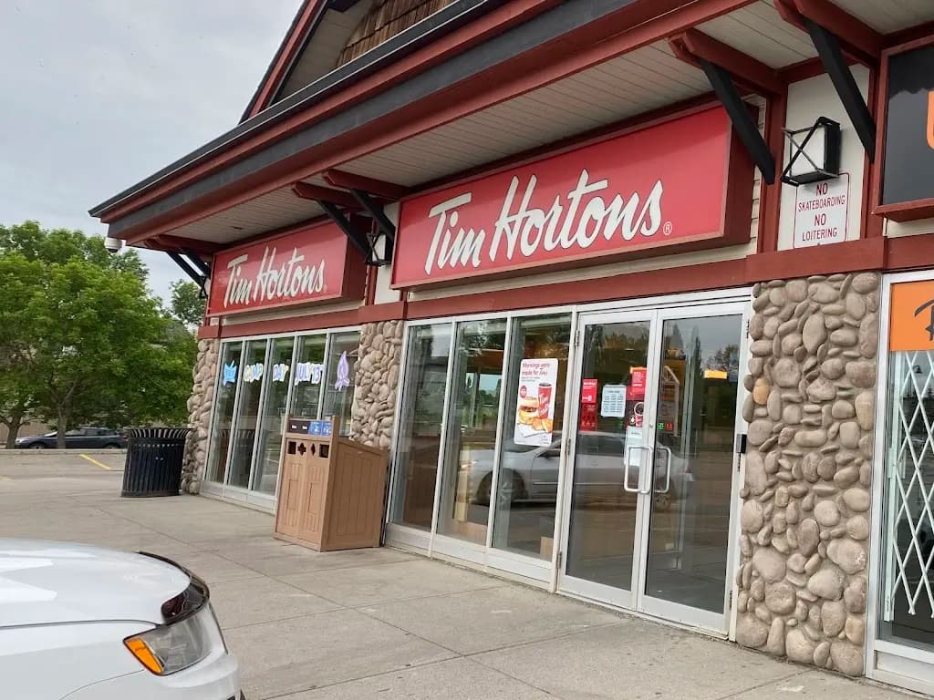 Tim Hortons storefront and interior at 10 Chaparral Dr Se, Calgary, AB