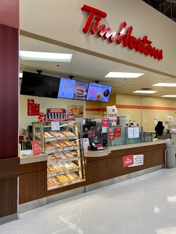 Tim Hortons storefront and interior at 100-20 Heritage Meadows, Calgary, AB