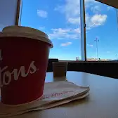 Tim Hortons storefront and interior at 1110 Panatella Blvd Nw, Calgary, AB
