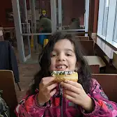 Tim Hortons storefront and interior at 1110 Panatella Blvd Nw, Calgary, AB