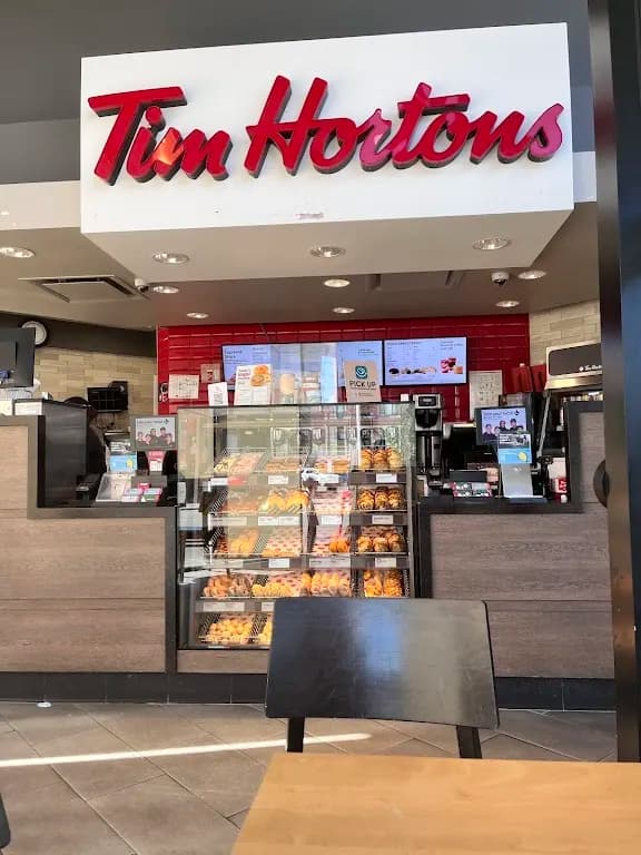 Tim Hortons storefront and interior at 117 1323 Centre St North, Calgary, AB