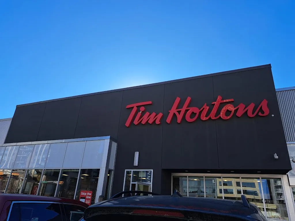 Tim Hortons storefront and interior at 1211 12th Ave Sw, Calgary, AB