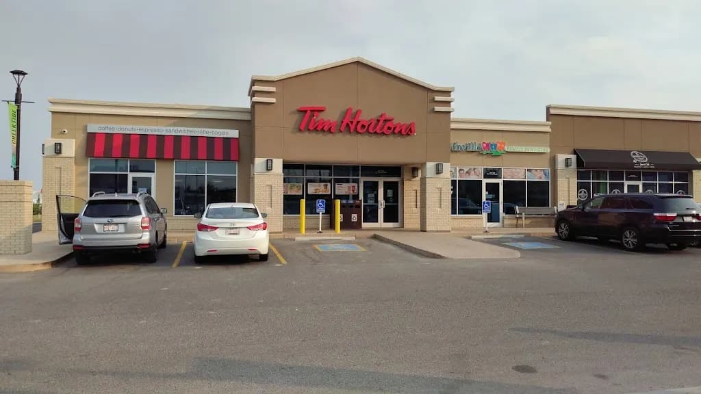 Tim Hortons storefront and interior at 12580 Symons Valley Rd Nw, Calgary, AB