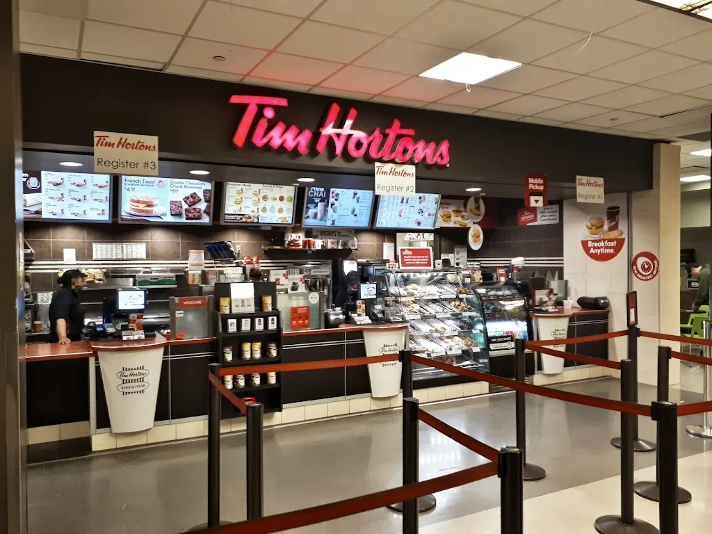 Tim Hortons storefront and interior at 1301 16th Ave Nw - Senator Burns Bldg, Calgary, AB