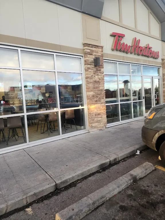 Tim Hortons storefront and interior at 151 Copperpond Blvd Se, Calgary, AB