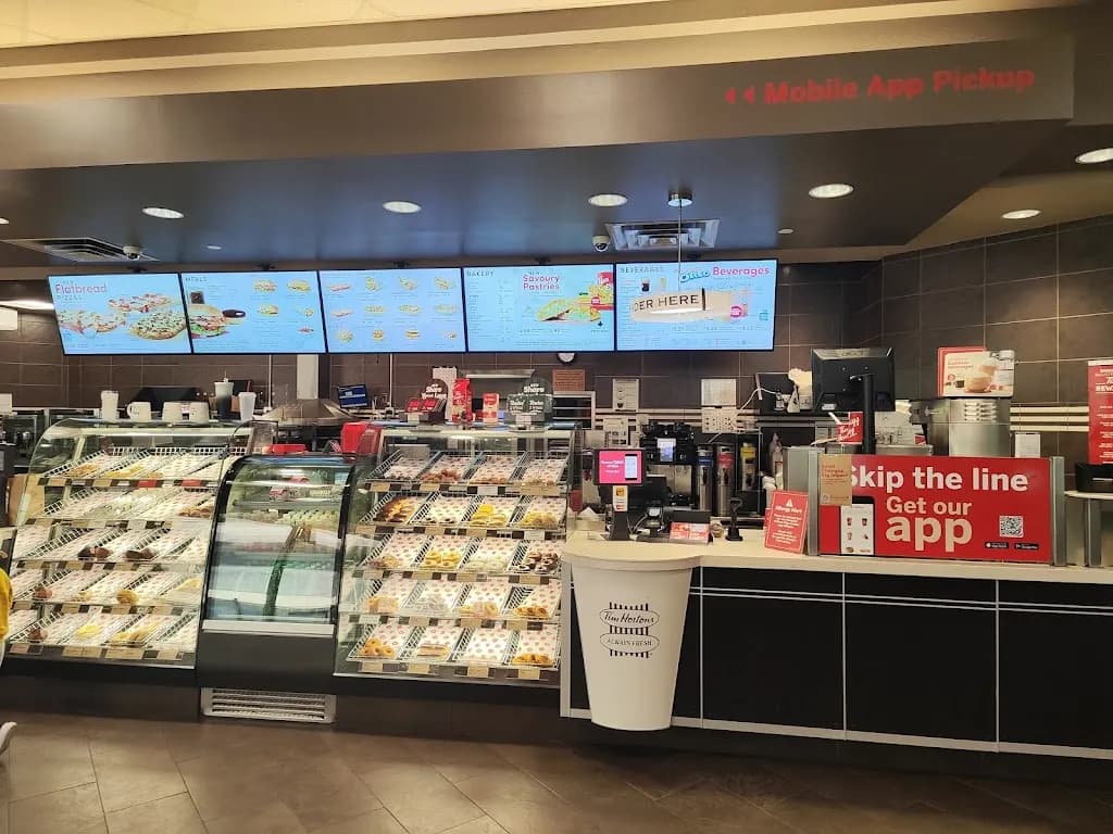 Tim Hortons storefront and interior at 225 7th Ave Sw, Calgary, AB