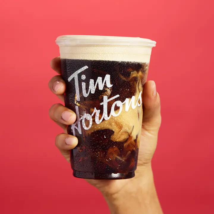Tim Hortons storefront and interior at 555 Saddledome Rise Se, Calgary, AB