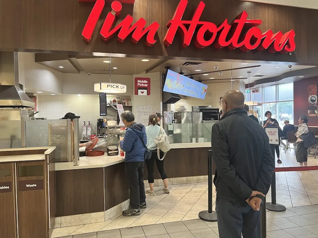 Tim Hortons storefront and interior at 1632 14th Ave Nw, Calgary, AB