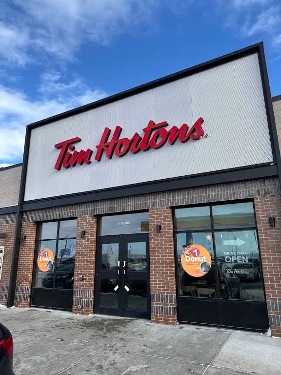 Tim Hortons storefront and interior at Unit 115 9182 Airport Link Ne, Calgary, AB