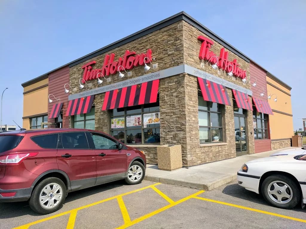 Tim Hortons storefront and interior at Wainwright Supermart, Denwood, AB
