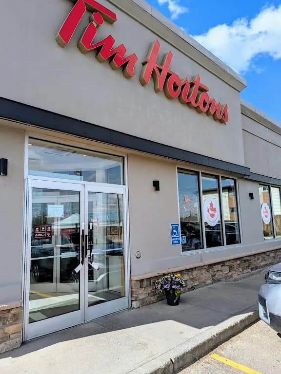 Tim Hortons storefront and interior at 1101 Highway N, Drumheller, AB