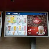 Tim Hortons storefront and interior at 1595 West Broadway, Vancouver, BC
