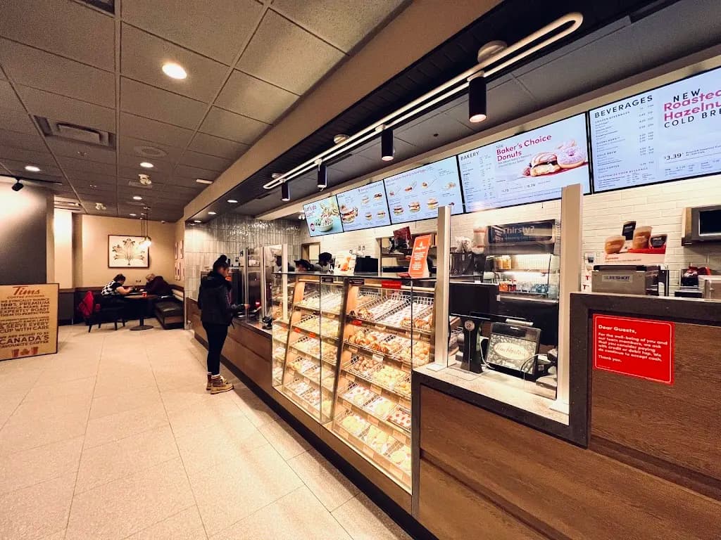 Tim Hortons storefront and interior at 1 Lombard Ave, Winnipeg, MB
