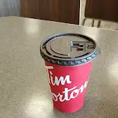 Tim Hortons storefront and interior at 19 Marion St, Winnipeg, MB