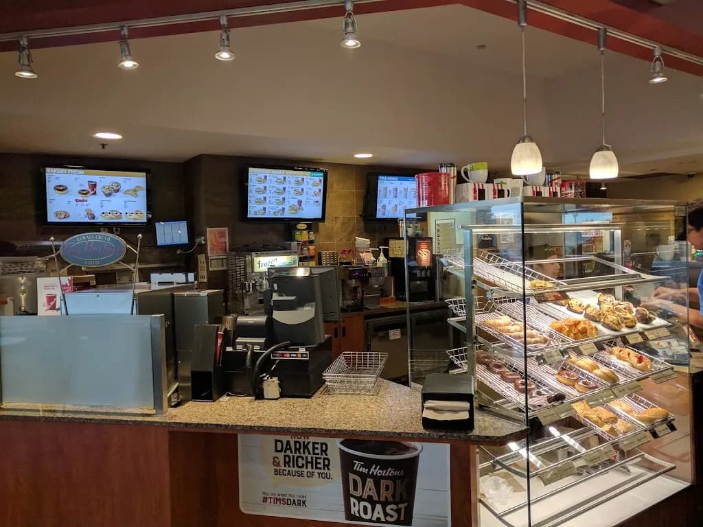 Tim Hortons storefront and interior at 300 Booth Dr, Winnipeg, MB