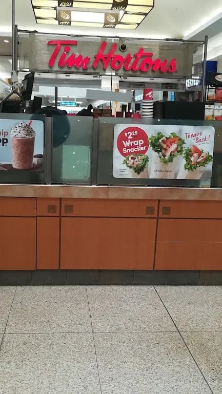 Tim Hortons storefront and interior at 1555 Regent Ave West, Winnipeg, MB