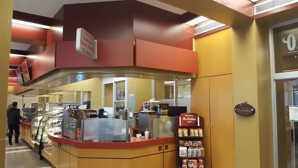 Tim Hortons storefront and interior at 2055 Notre Dame Avenue, Winnipeg, MB