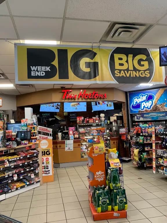 Tim Hortons storefront and interior at 1136 Golf Links Rd, Ancaster, ON