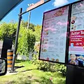 Tim Hortons storefront and interior at 80 Bayfield St, Barrie, ON