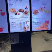 Tim Hortons storefront and interior at 90 Clementine Dr, Brampton, ON