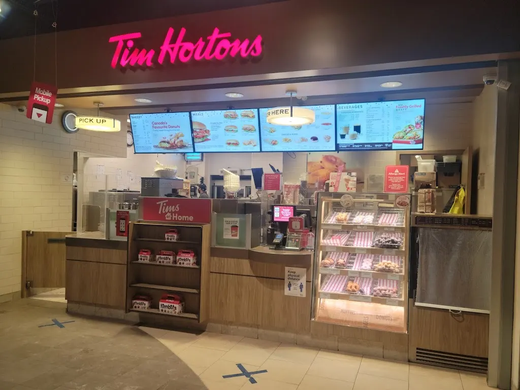 Tim Hortons storefront and interior at 7965 Financial Dr, Brampton, ON