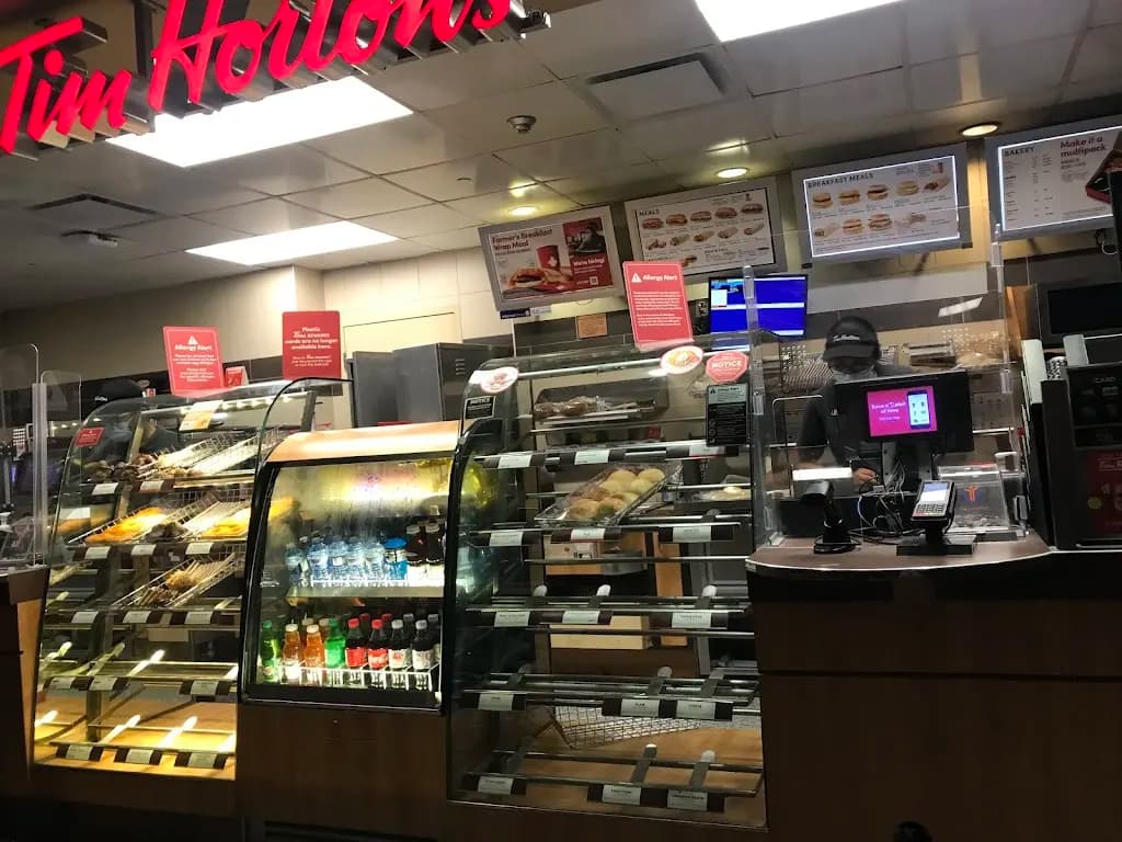 Tim Hortons storefront and interior at 50 Charlton Ave E, Hamilton, ON