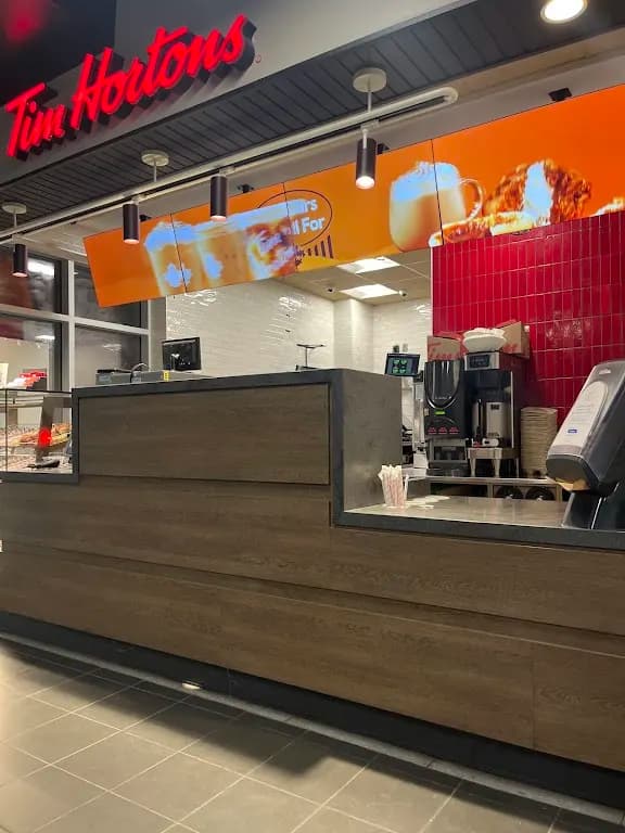 Tim Hortons storefront and interior at 1525 Centennial Dr., Kingston, ON