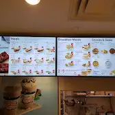 Tim Hortons storefront and interior at 100 City Centre Dr, Mississauga, ON