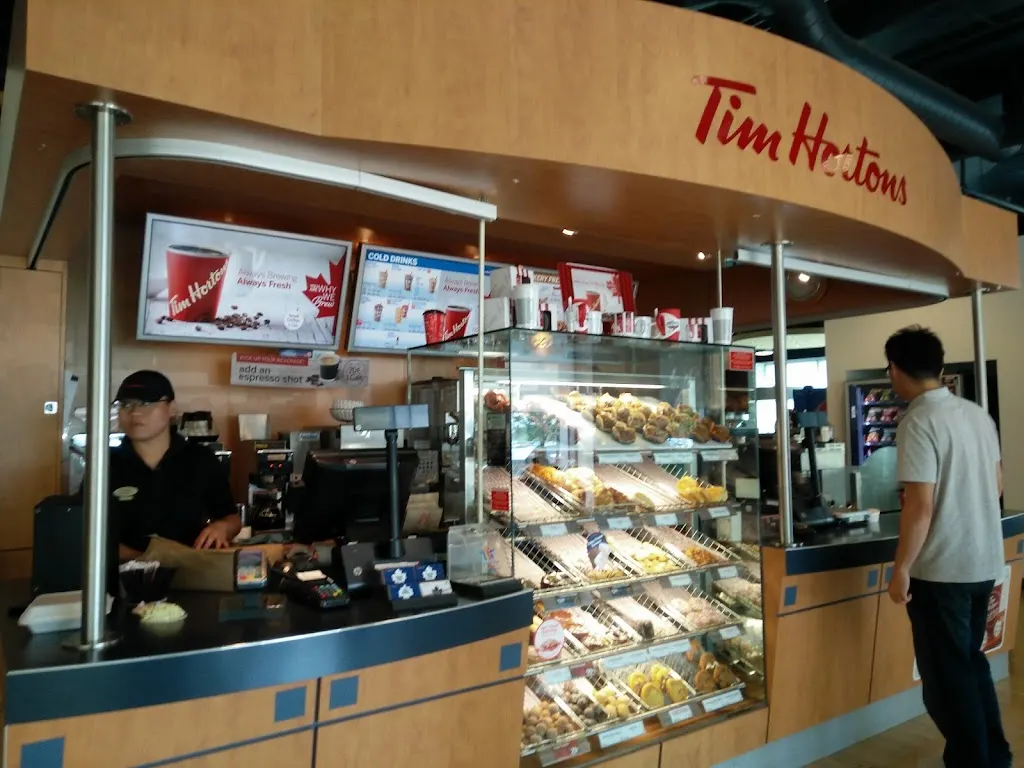 Tim Hortons storefront and interior at Td Creekside Building, Mississauga, ON
