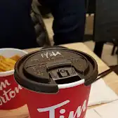 Tim Hortons storefront and interior at 8 Clock Tower Road, North York, ON