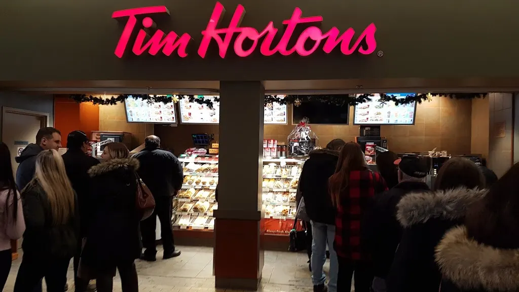Tim Hortons storefront and interior at 1445 Riverside Dr, Timmins, ON