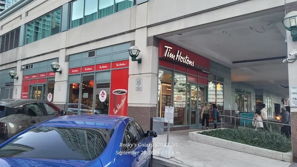 Tim Hortons storefront and interior at 16 Queens Quay West, Toronto, ON