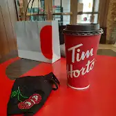 Tim Hortons storefront and interior at 16 Queens Quay West, Toronto, ON