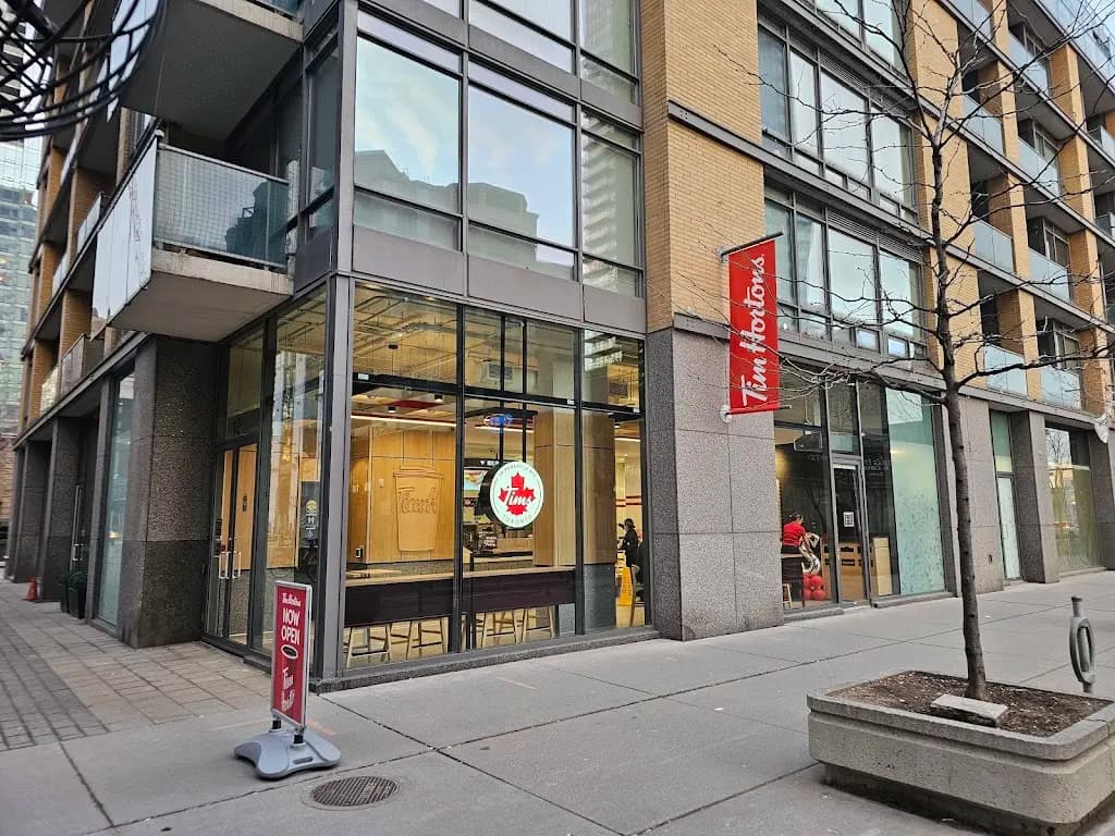 Tim Hortons storefront and interior at 18 Yorkville Avenue, Toronto, ON