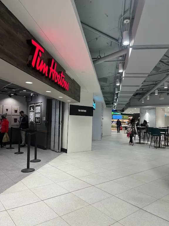 Tim Hortons storefront and interior at 20 Eglinton Ave West, Toronto, ON