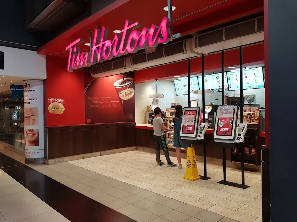 Tim Hortons storefront and interior at 26 Dundas St, Toronto, ON