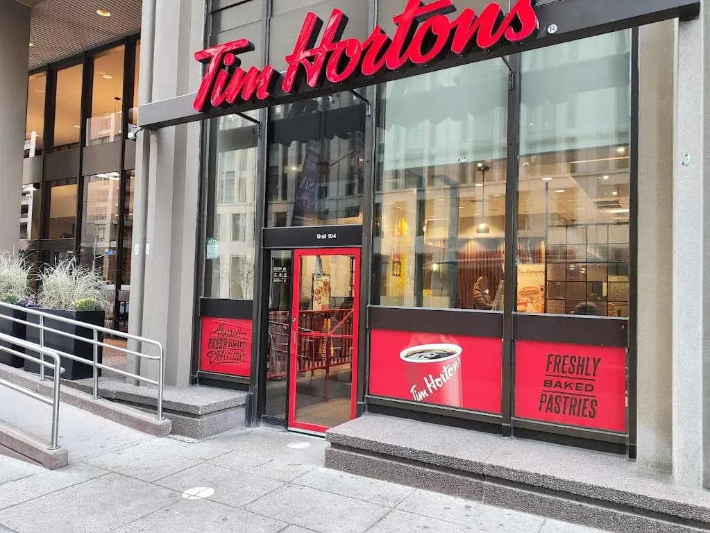 Tim Hortons storefront and interior at 56 Wellesley St West, Toronto, ON