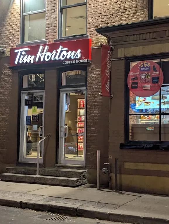 Tim Hortons storefront and interior at 70 Gerrard St West, Toronto, ON