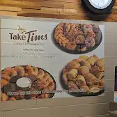 Tim Hortons storefront and interior at 70 Gerrard St West, Toronto, ON