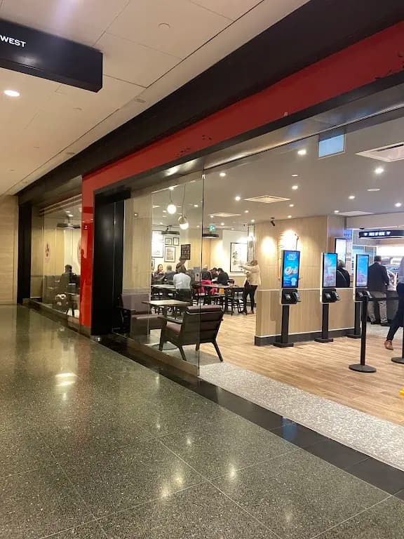 Tim Hortons storefront and interior at 77 King Street West, Toronto, ON