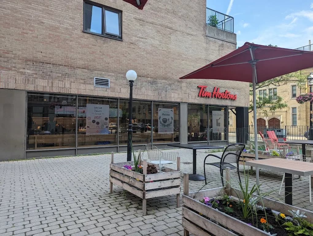 Tim Hortons storefront and interior at 82 Adelaide St E, Toronto, ON