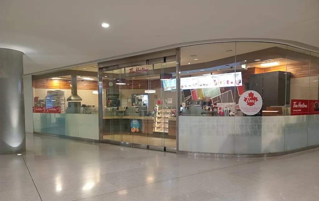 Tim Hortons storefront and interior at 120 Bremner Blvd, Toronto, ON