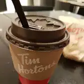 Tim Hortons storefront and interior at 120 Bremner Blvd, Toronto, ON