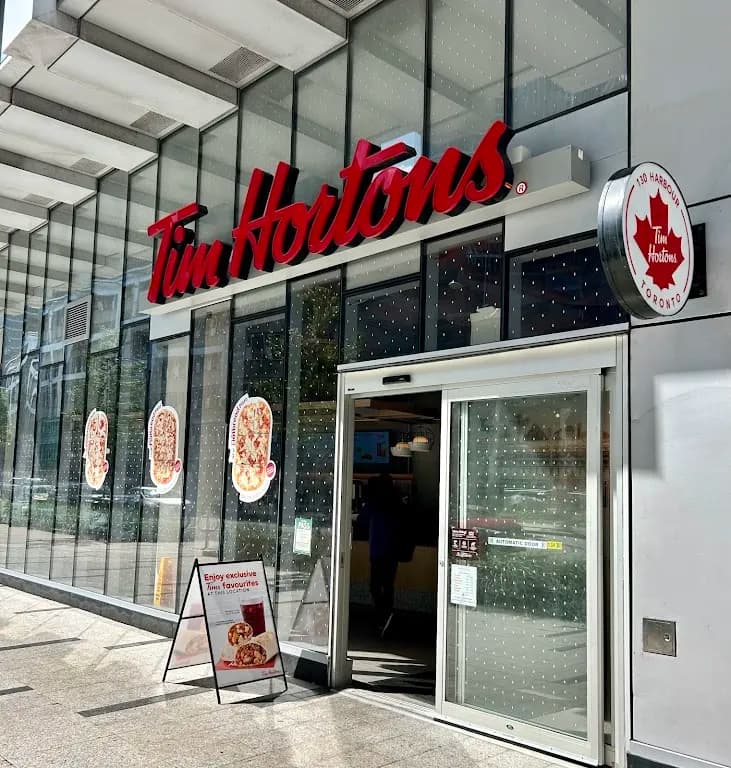 Tim Hortons storefront and interior at 130 Harbour Street, Toronto, ON
