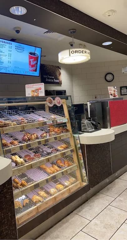 Tim Hortons storefront and interior at 145 King St West, Toronto, ON