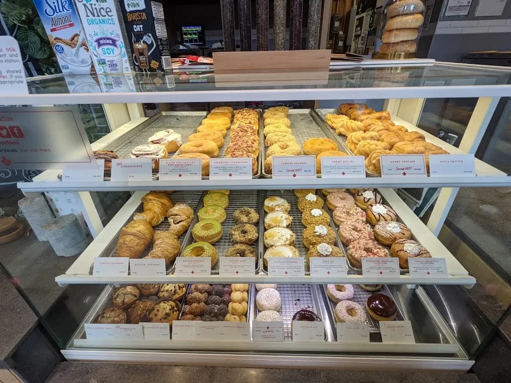 Tim Hortons storefront and interior at 148 Simcoe St, Toronto, ON