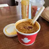 Tim Hortons storefront and interior at 148 Simcoe St, Toronto, ON