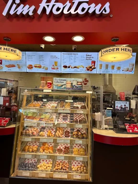 Tim Hortons storefront and interior at 150 Dupont St, Toronto, ON