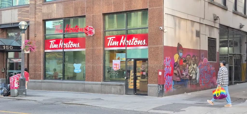 Tim Hortons storefront and interior at 150 John St, Toronto, ON