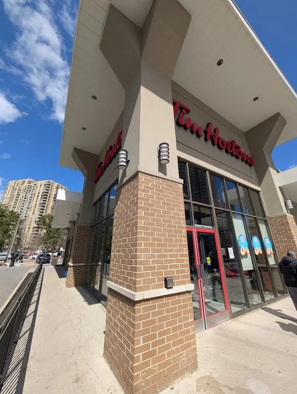 Tim Hortons storefront and interior at 150 Wynford Dr, Toronto, ON